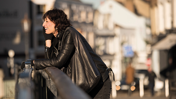 man-observing-stoma-pouch-on-his-abdomen-thinking-about-body-image-concerns-with-a-stoma
